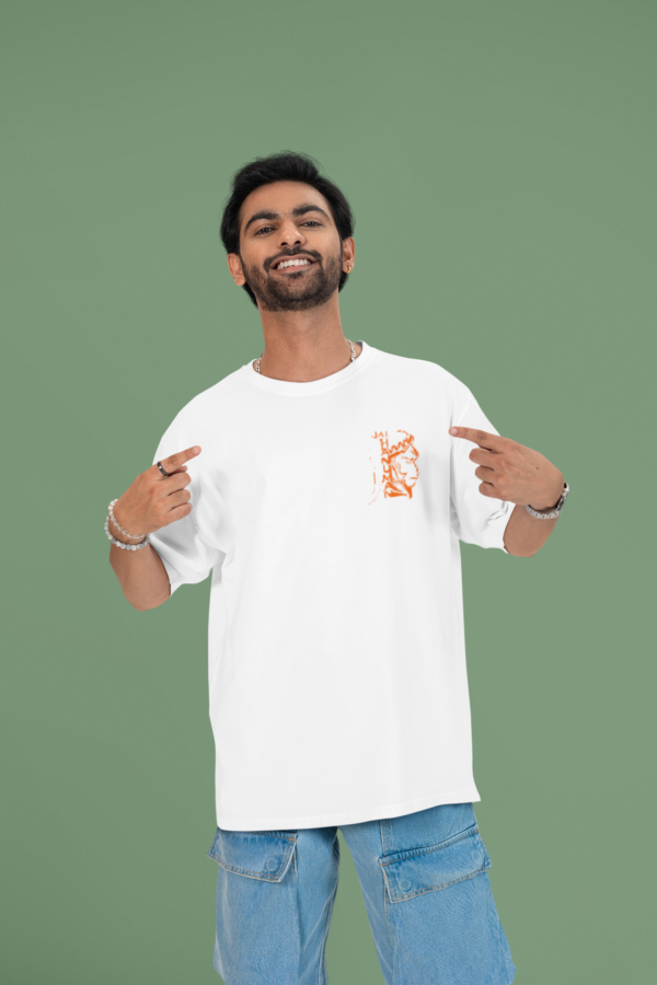 mockup of a cheerful man pointing at his oversized round neck t shirt in a studio m53040 (3)