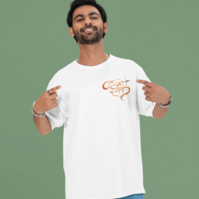 mockup of a cheerful man pointing at his oversized round neck t shirt in a studio m53040 (3)