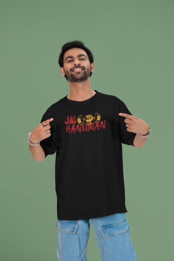 mockup of a cheerful man pointing at his oversized round neck t shirt in a studio m53040 (6)