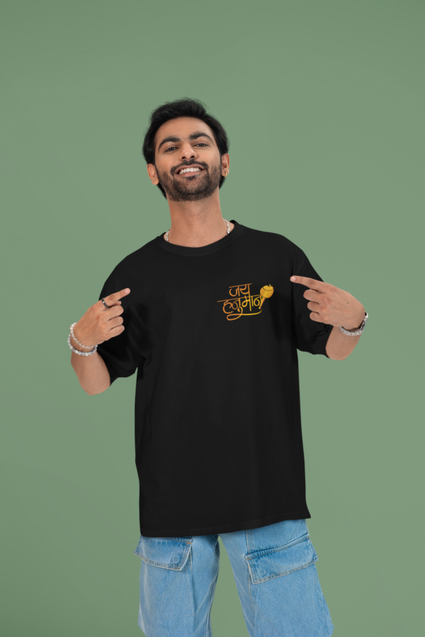 mockup of a cheerful man pointing at his oversized round neck t shirt in a studio m53040 (3)
